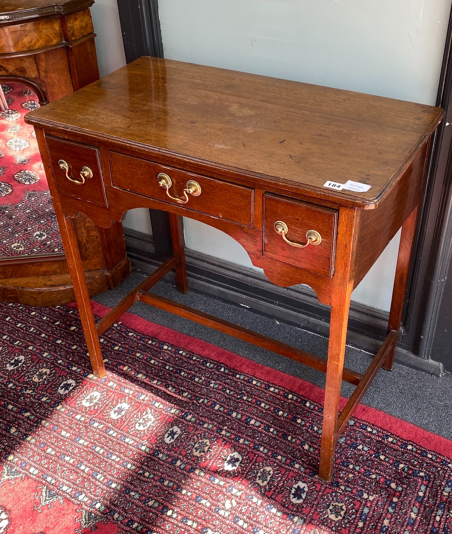 A George III mahogany lowboy, fitted three small drawers, width 75cm, depth 42cm, height 75cm